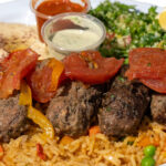 Sultan's Market Kefta Kabob dinner. (Middle Eastern Meatloaf) minced lamb and beef combined with traditional herbs and spices, then baked with tomatoes and onions.