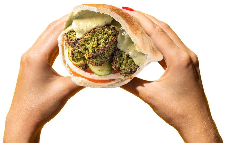 Hands holding a Falafel Sandwich from Sultan's Market. Chicago's Best Falafel